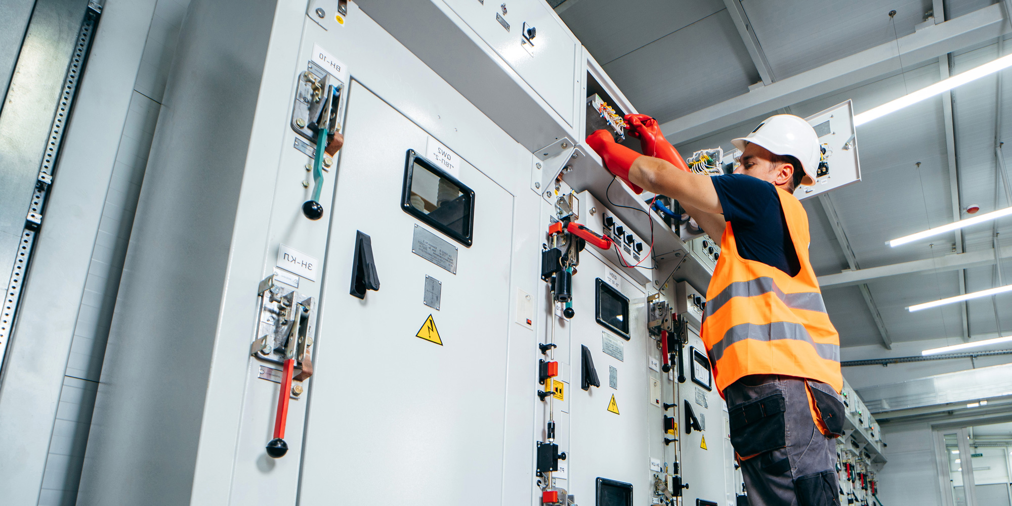Technician inspecting a power transformer
